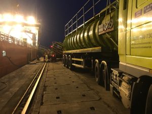 Late night works removing waste from ship